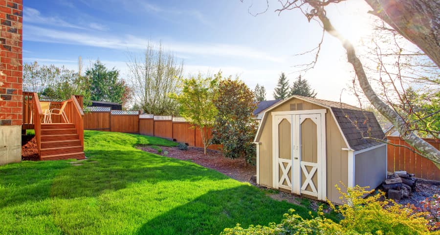 Fenced backyard with storage shed in Oakland